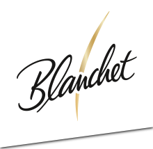 Das Logo von Blanchet zeigt elegante, geschwungene Schriftzüge in Schwarz und Gold auf einem weißen Hintergrund.